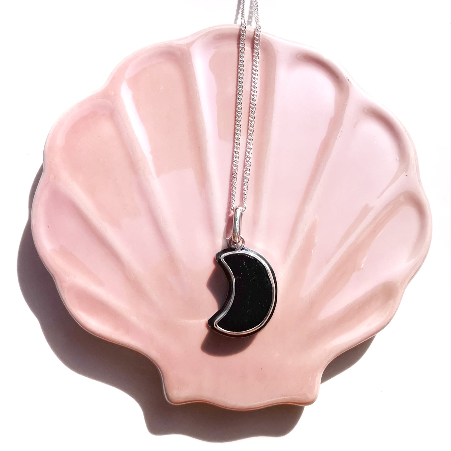 Scottish black crescent moon sea glass & sterling silver pendant.