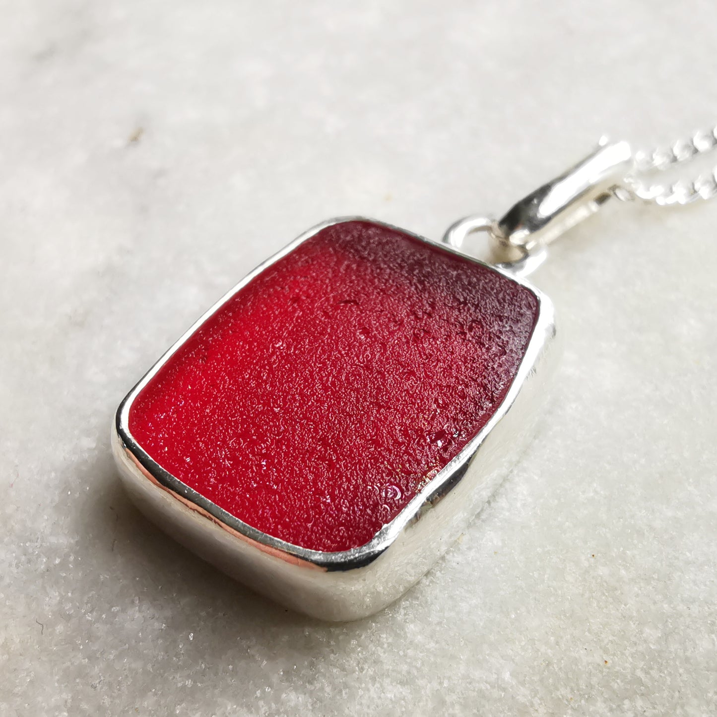 Scottish red UV sea glass & sterling silver pendant.