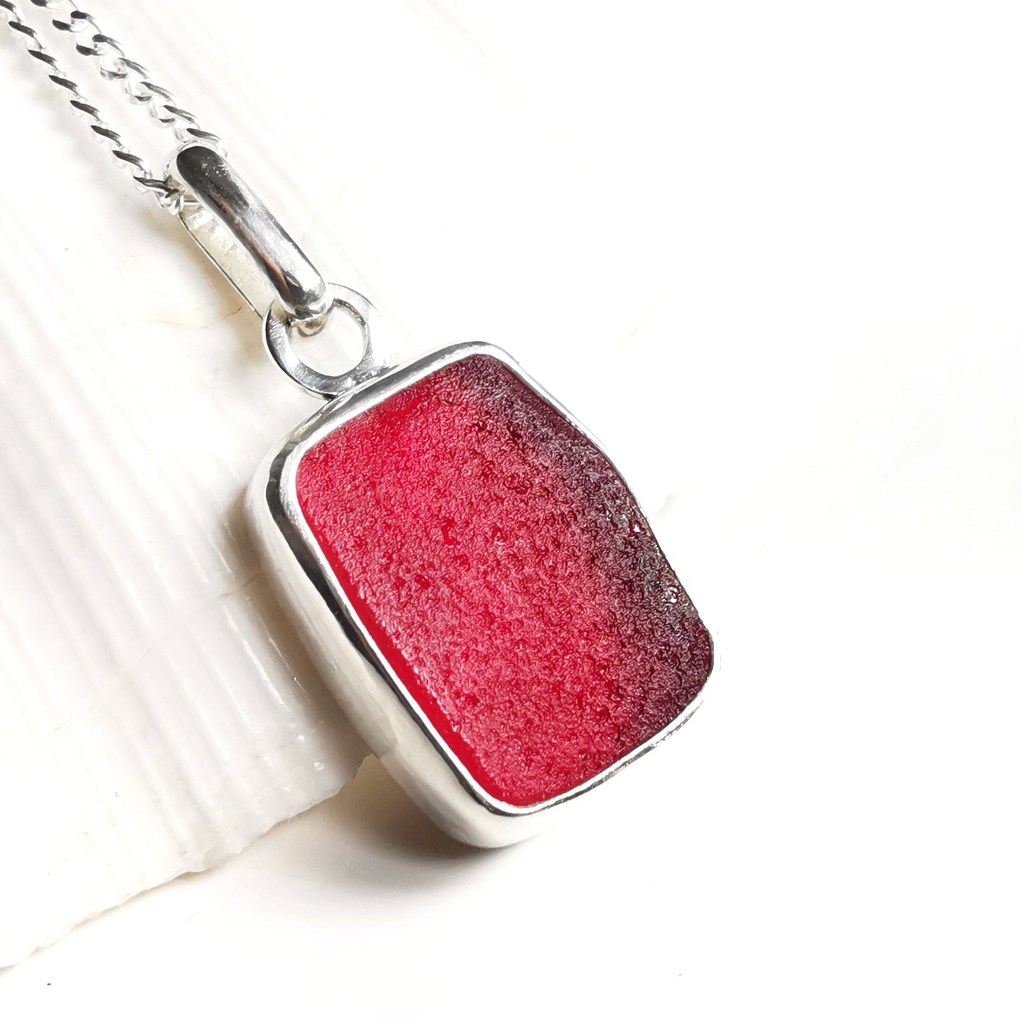 Scottish red UV sea glass & sterling silver pendant.