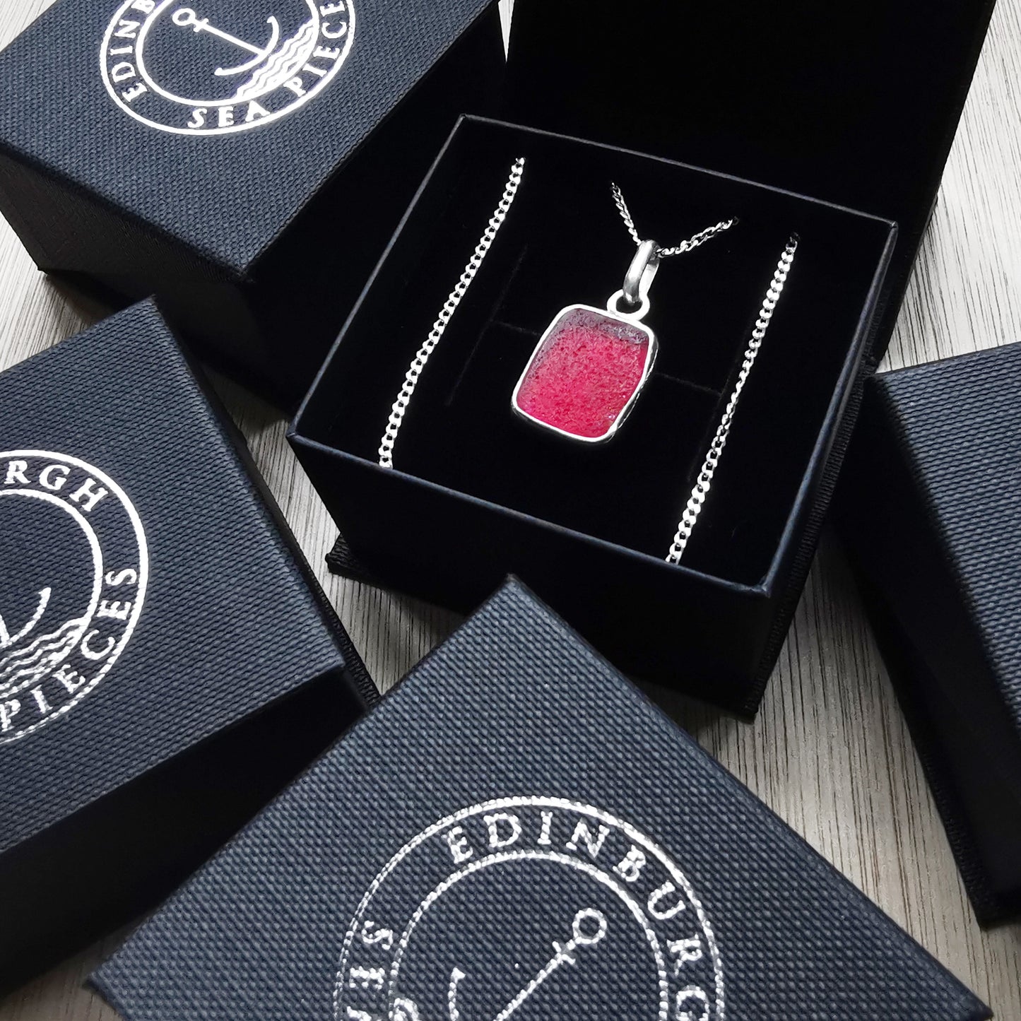 Scottish red UV sea glass & sterling silver pendant.