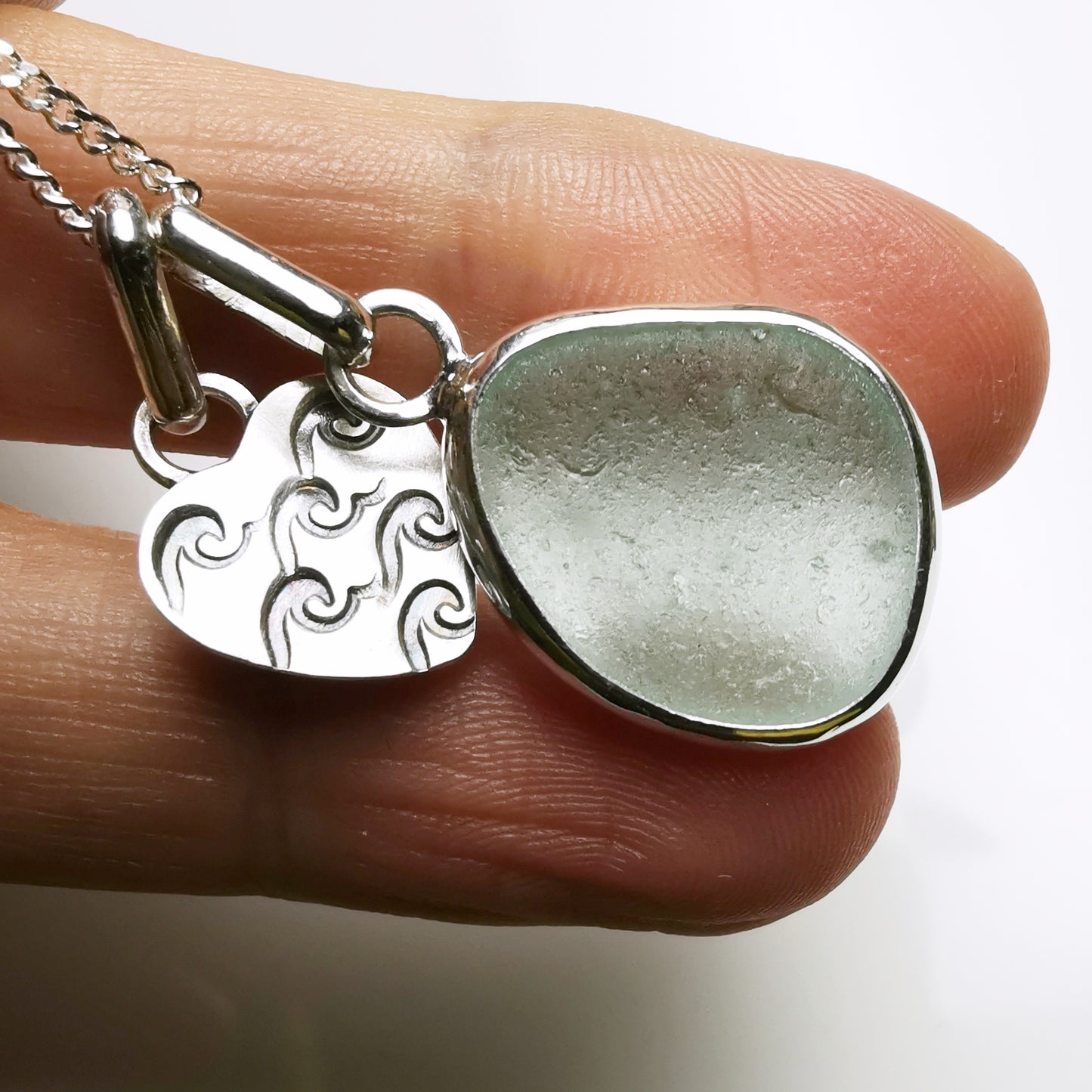 Tiny Scottish pink sea glass heart and light teal blue duo pendants in sterling silver.
