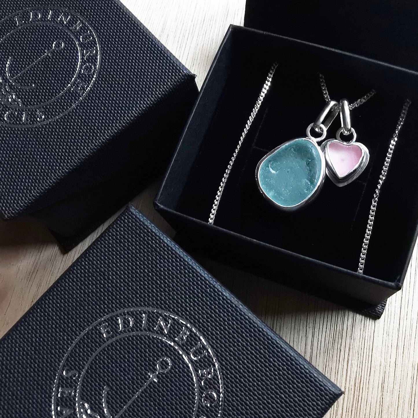 Tiny Scottish pink sea glass heart and light teal blue duo pendants in sterling silver.