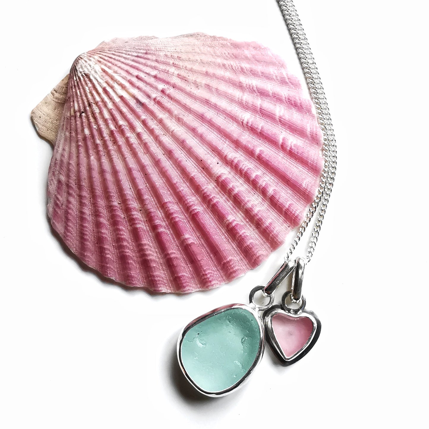 Tiny Scottish pink sea glass heart and light teal blue duo pendants in sterling silver.