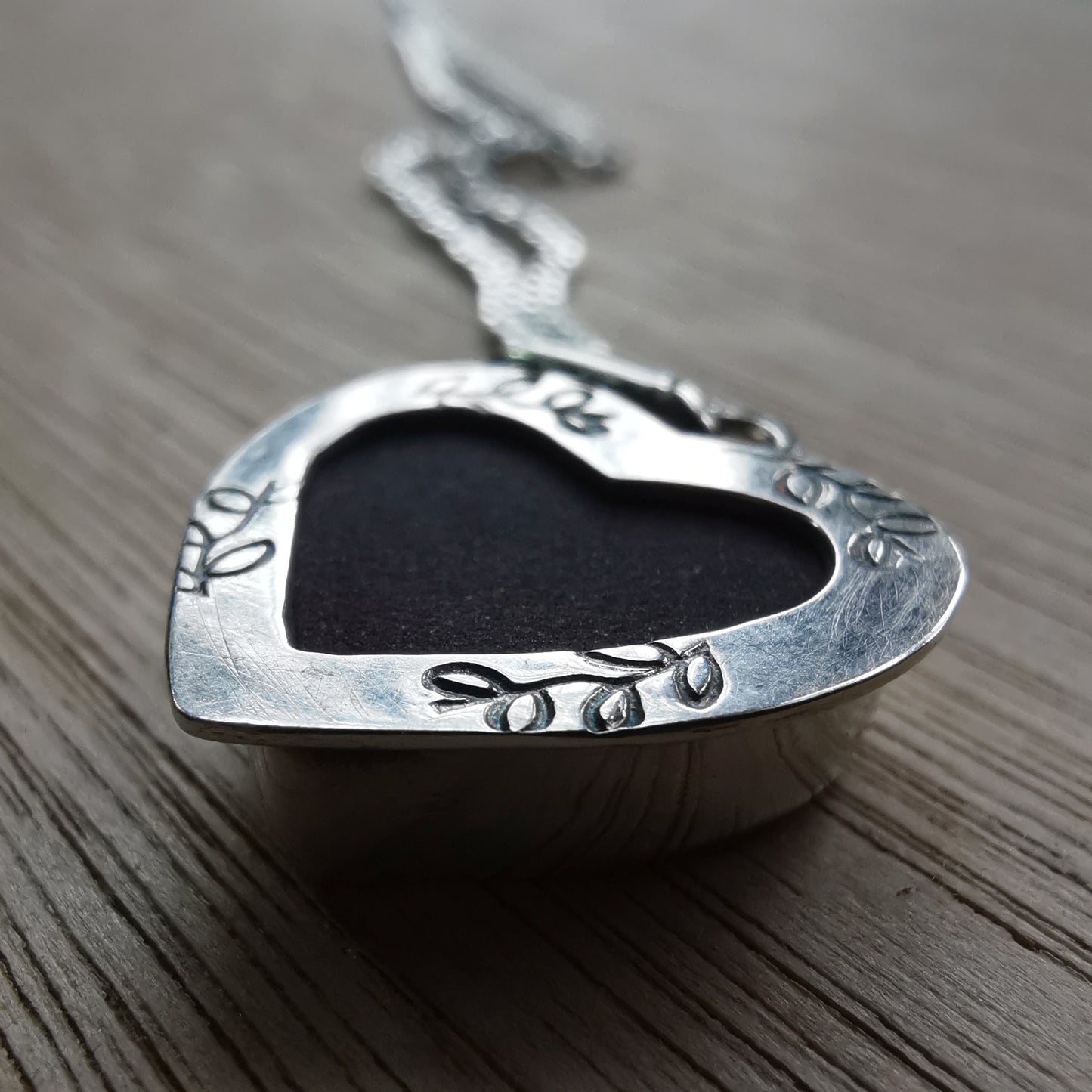 Burgundy red sea glass heart & sterling silver pendant.