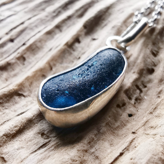 Teal blue 'jelly bean' sea glass & sterling silver pendant.
