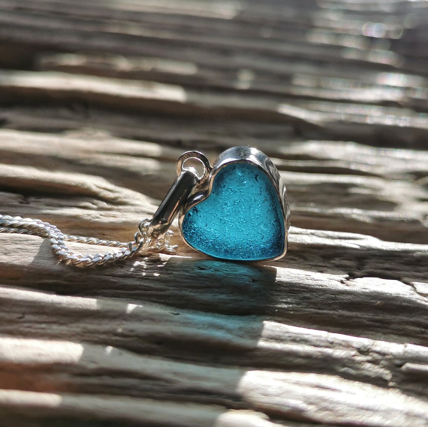 Scottish dark teal blue sea glass heart & sterling silver pendant.
