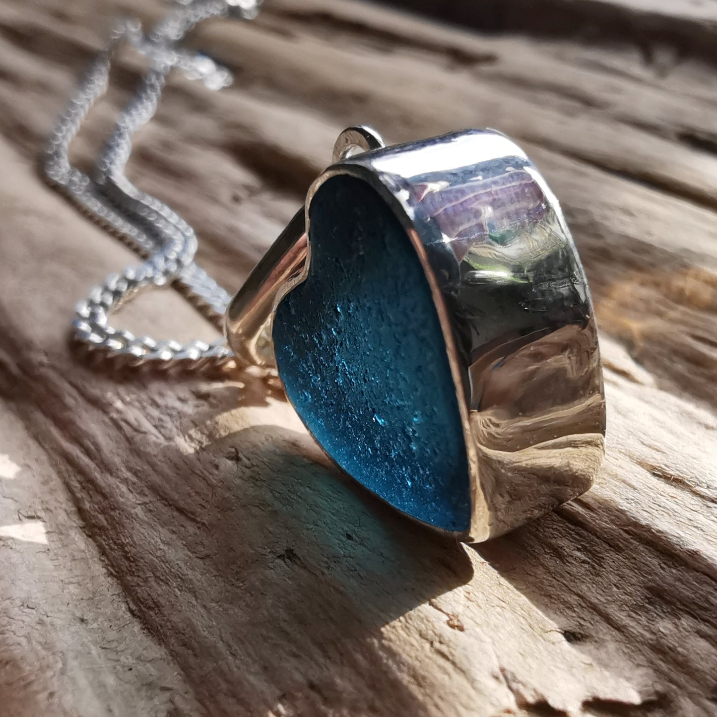 Scottish dark teal blue sea glass heart & sterling silver pendant.