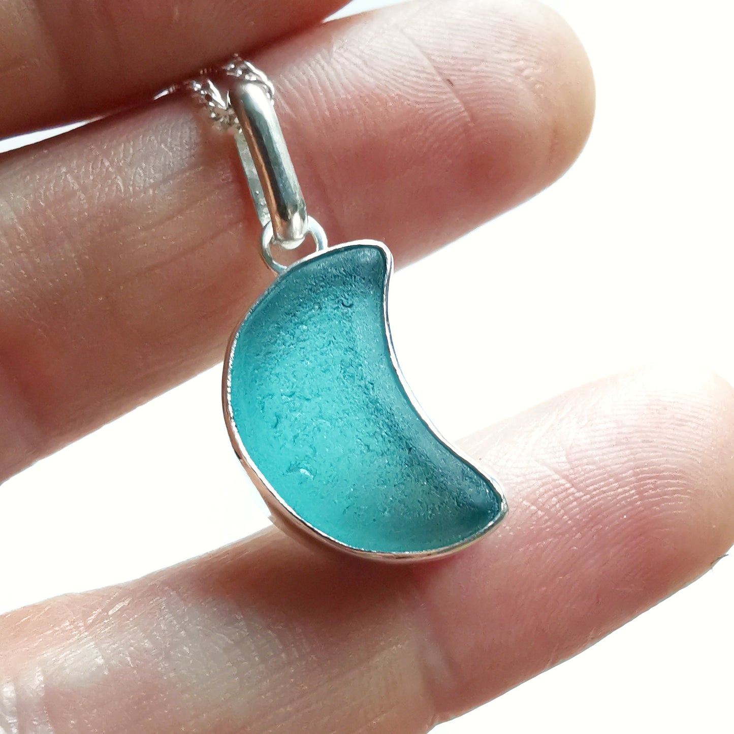 Scottish teal blue crescent moon sea glass & sterling silver pendant.