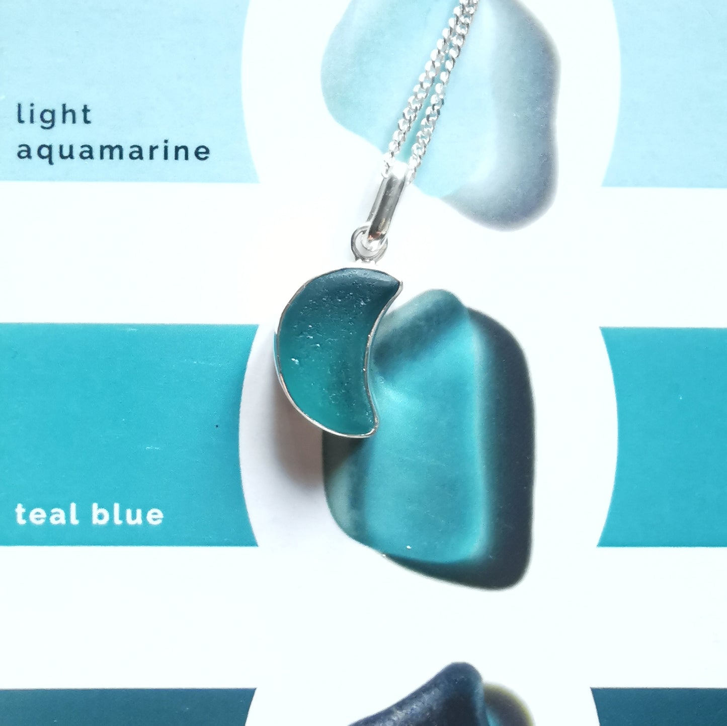 Scottish teal blue crescent moon sea glass & sterling silver pendant.