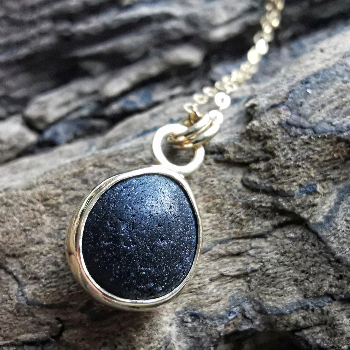 Genuine black sea glass & 9ct gold pendant.