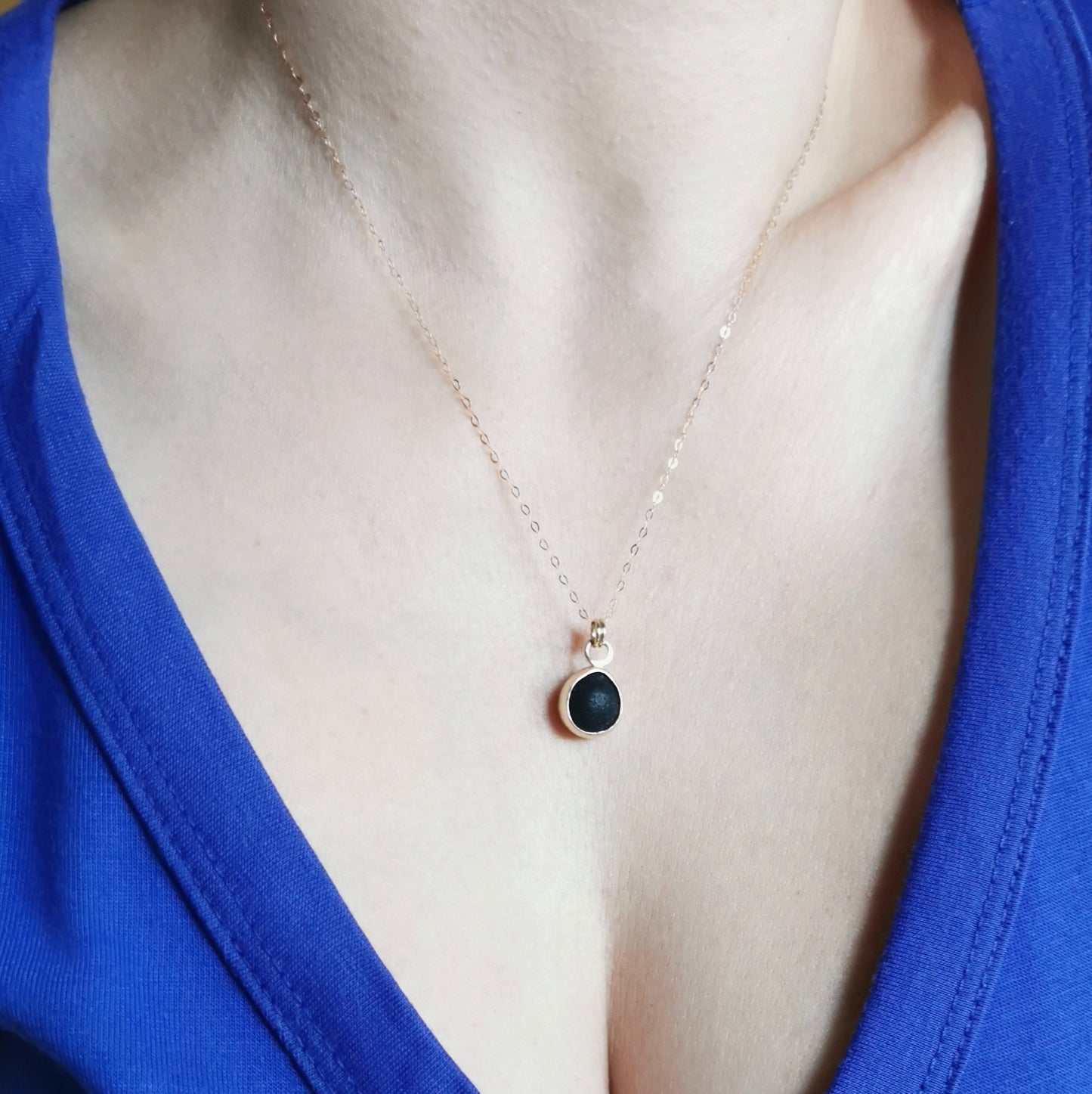 Genuine black sea glass & 9ct gold pendant.