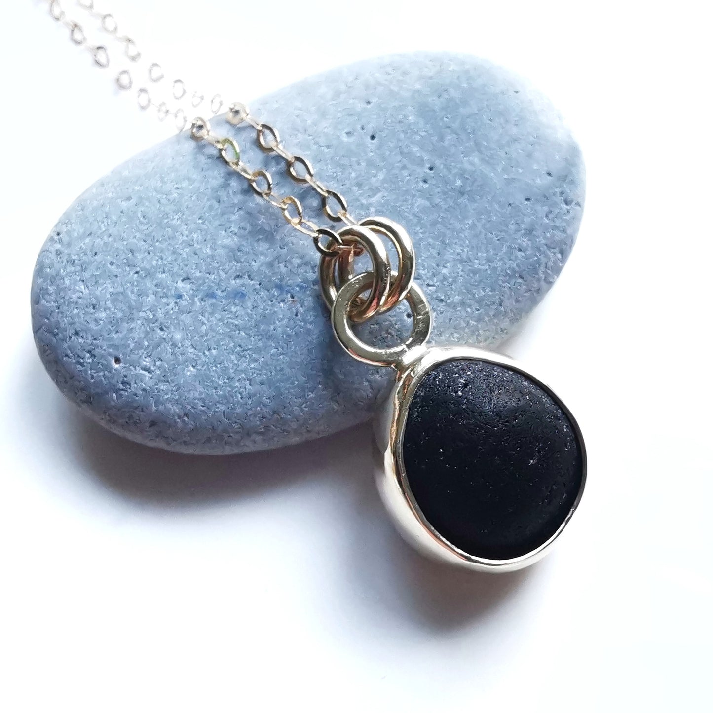 Genuine black sea glass & 9ct gold pendant.