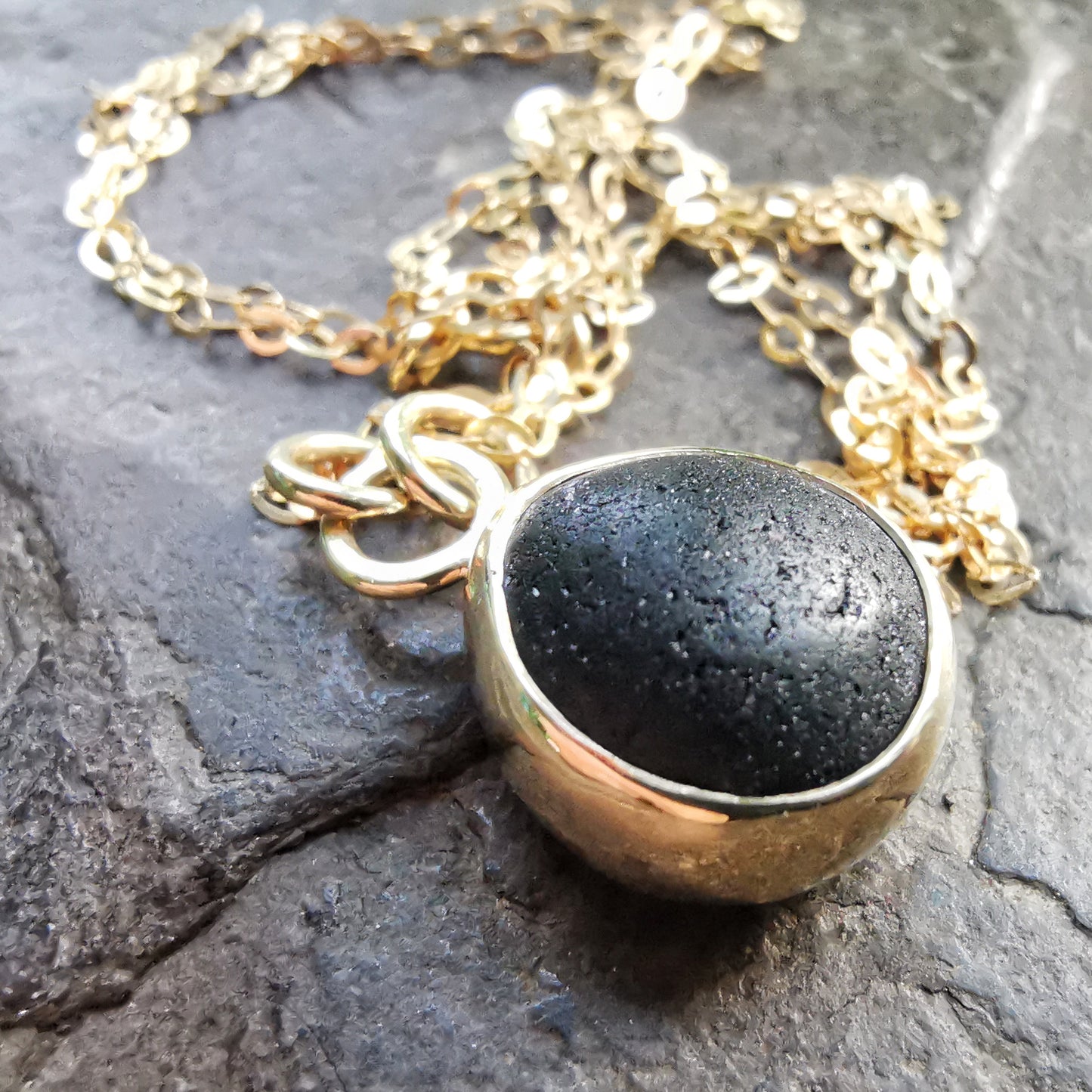 Genuine black sea glass & 9ct gold pendant.