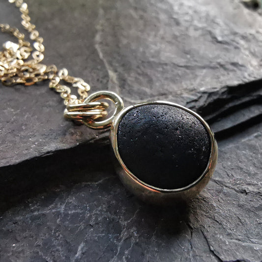 Genuine black sea glass & 9ct gold pendant.