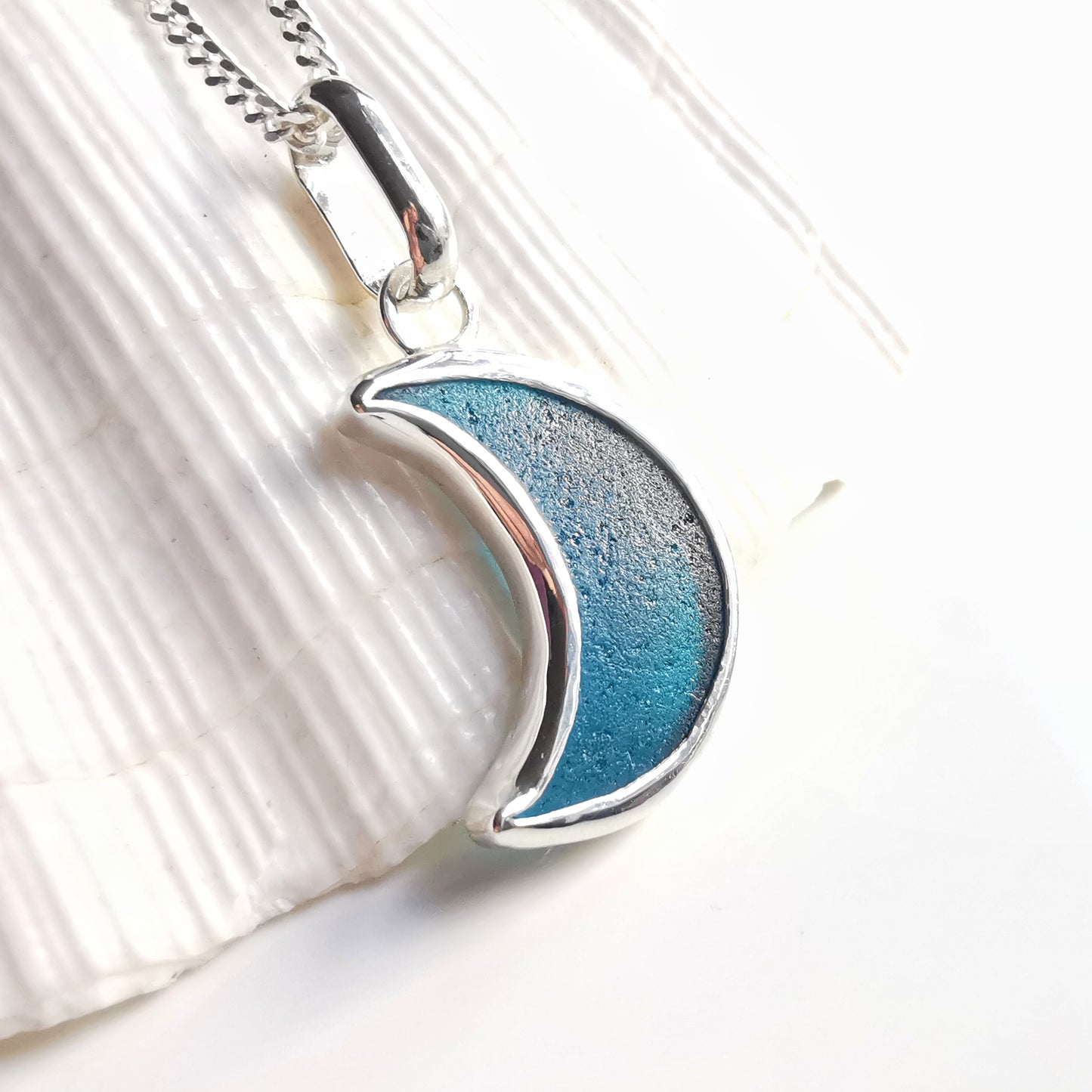 Reserved. Scottish teal blue crescent moon sea glass & sterling silver pendant.