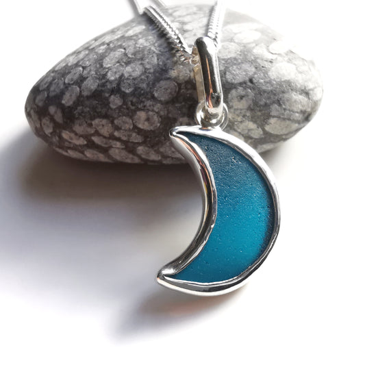 Reserved. Scottish teal blue crescent moon sea glass & sterling silver pendant.
