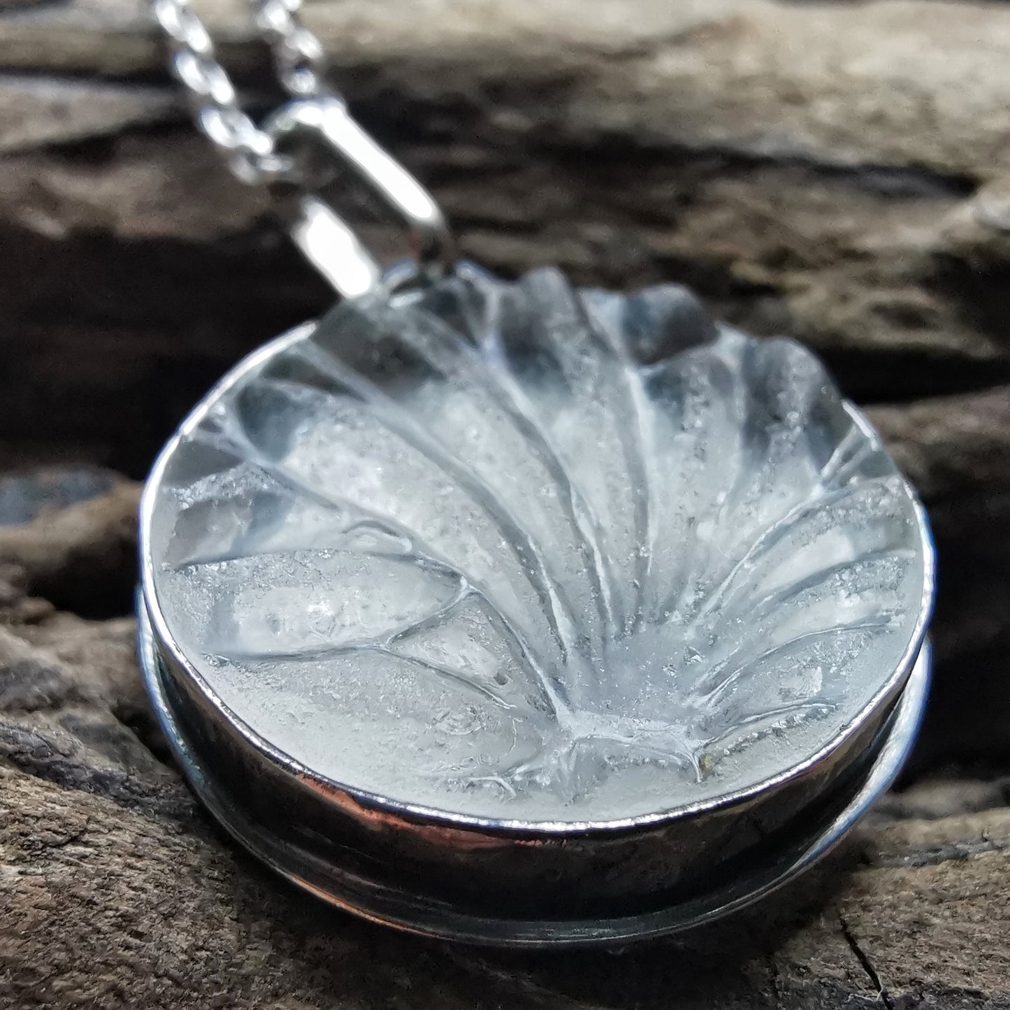 Clear sea glass & sterling silver pendant.