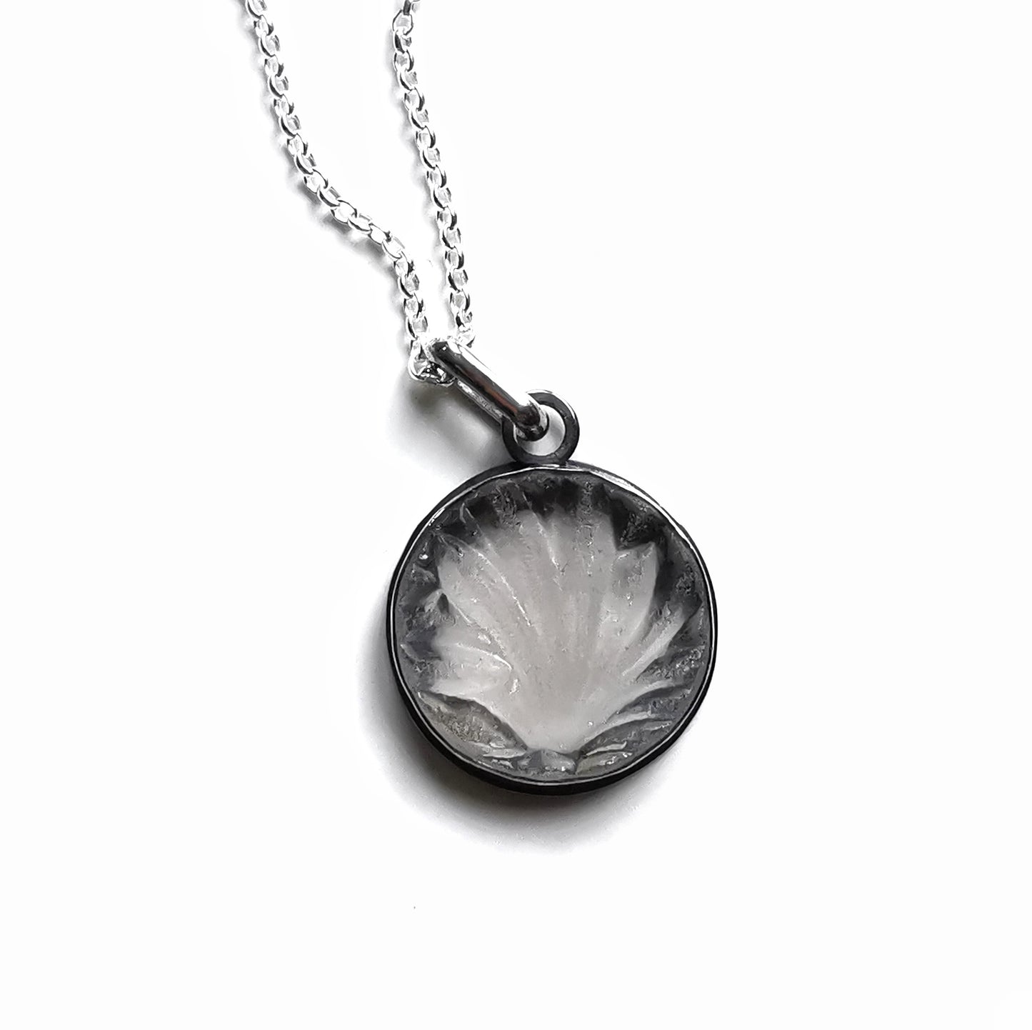 Clear sea glass & sterling silver pendant.