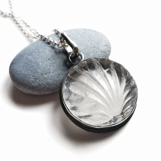 Clear sea glass & sterling silver pendant.