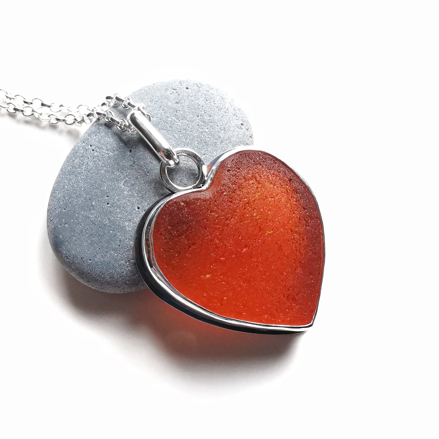Reserved. Scottish UV deep orange sea glass heart & sterling silver pendant.