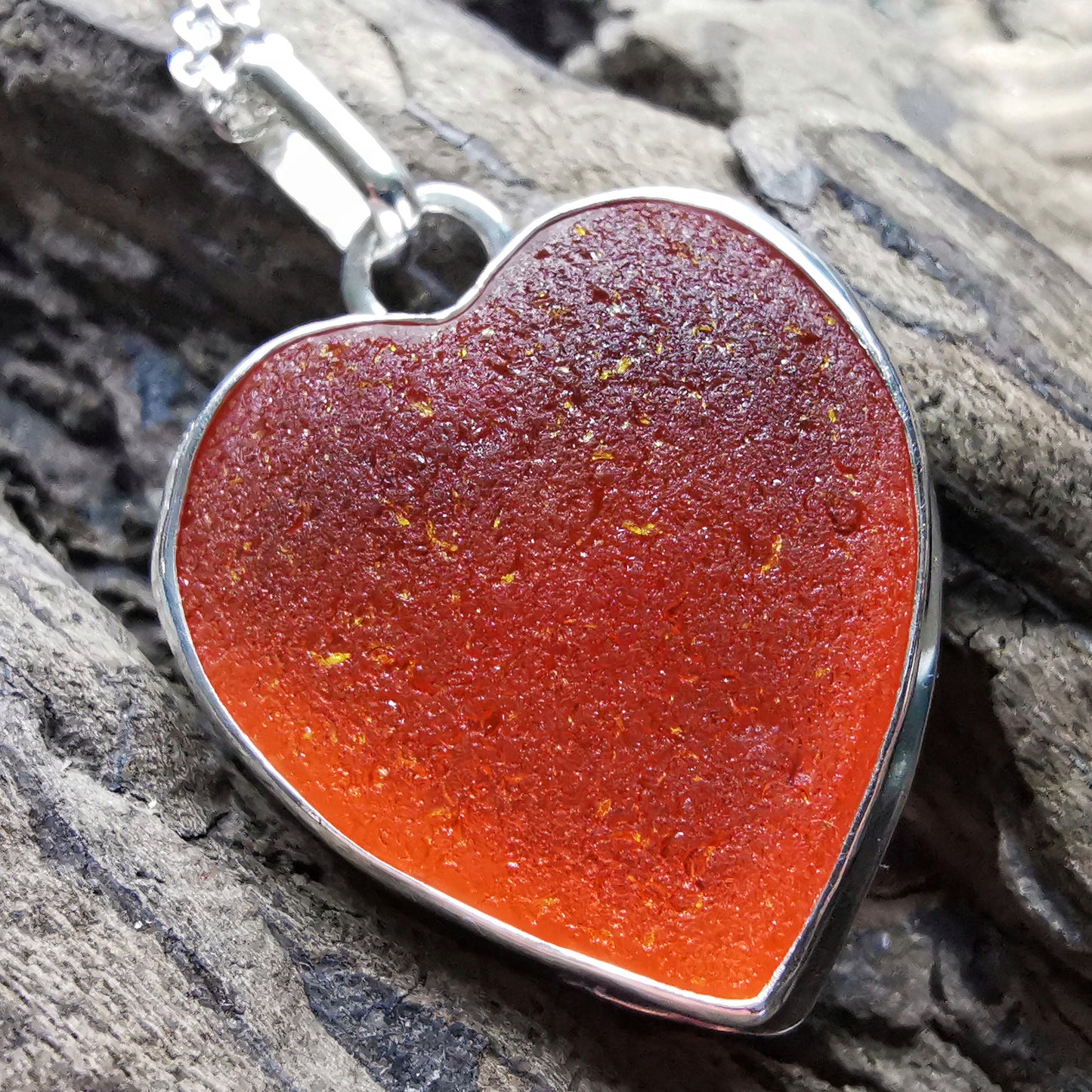 Reserved. Scottish UV deep orange sea glass heart & sterling silver pendant.