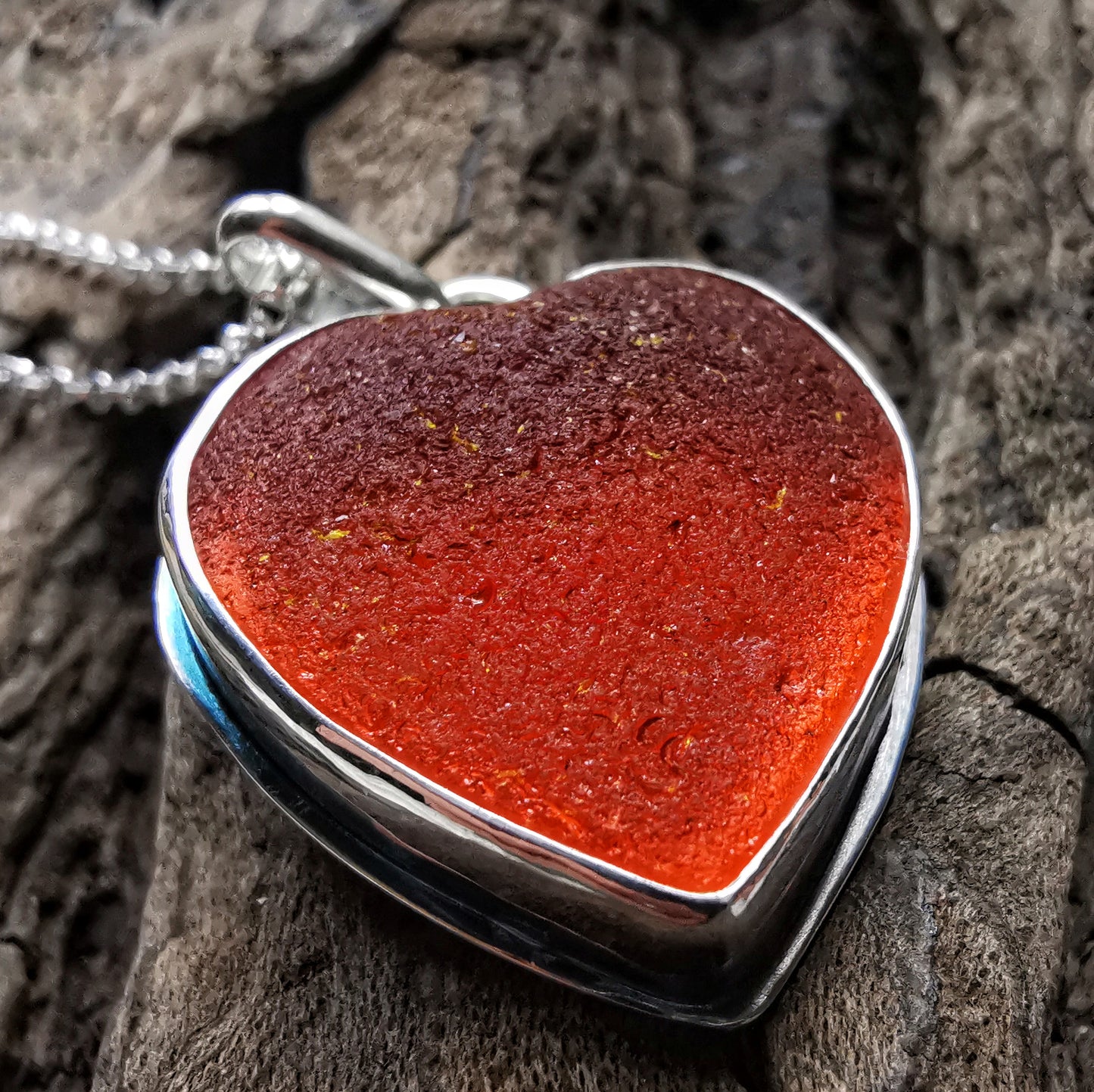 Reserved. Scottish UV deep orange sea glass heart & sterling silver pendant.