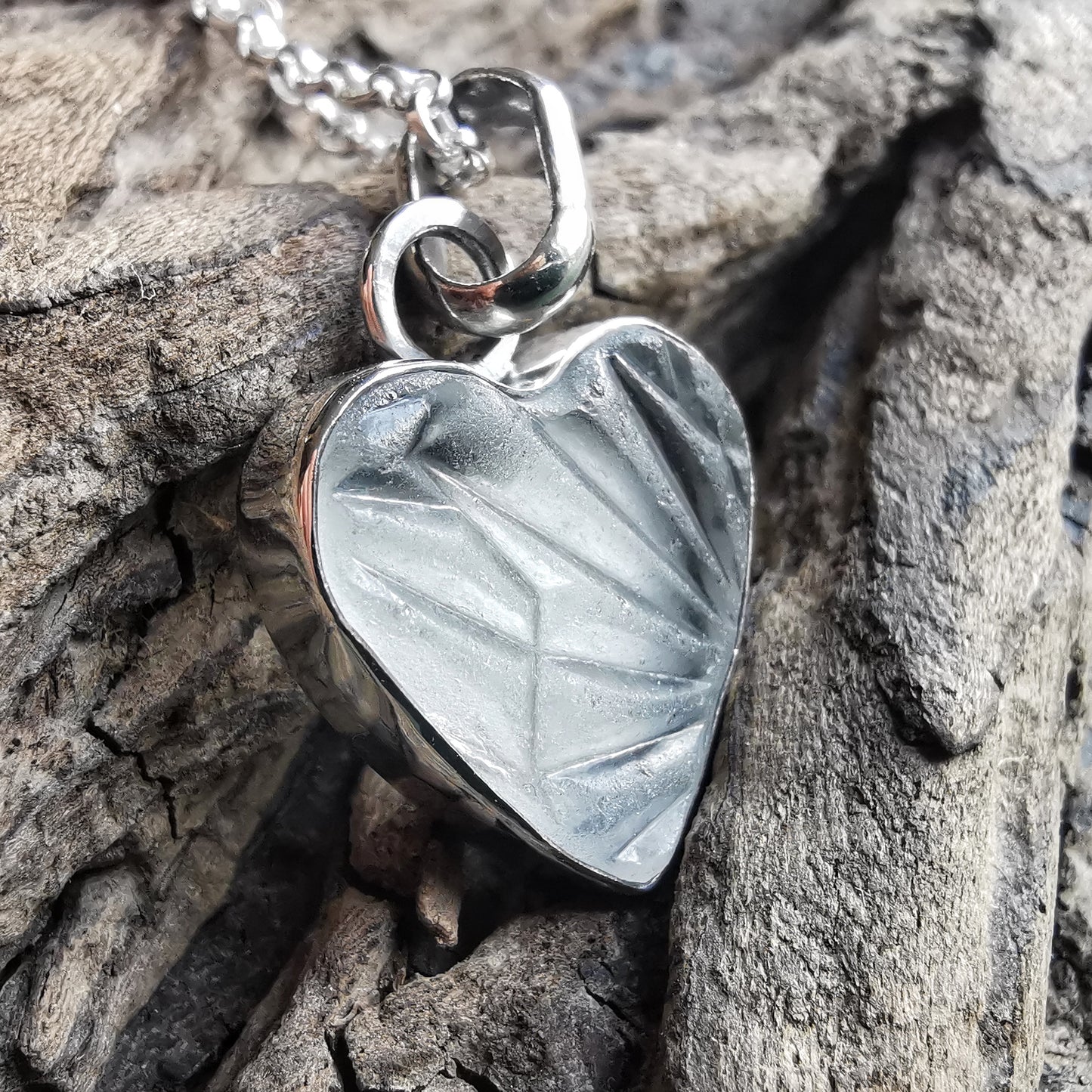 Clear sea glass heart & sterling silver pendant.