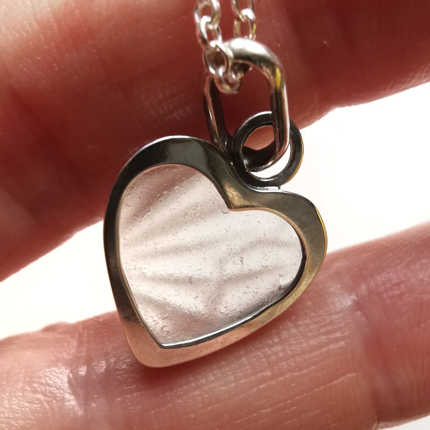 Clear sea glass heart & sterling silver pendant.