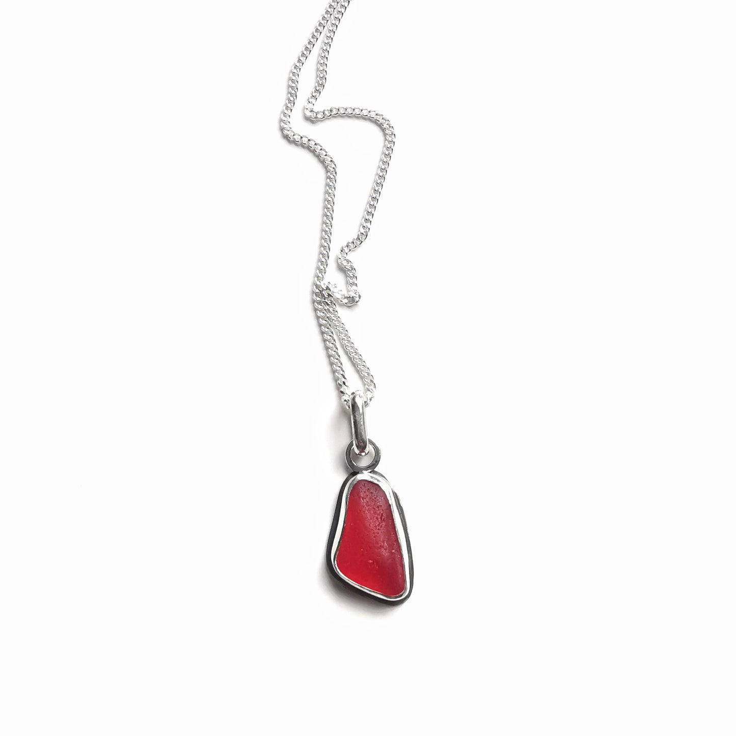 Scottish red sea glass & sterling silver pendant.