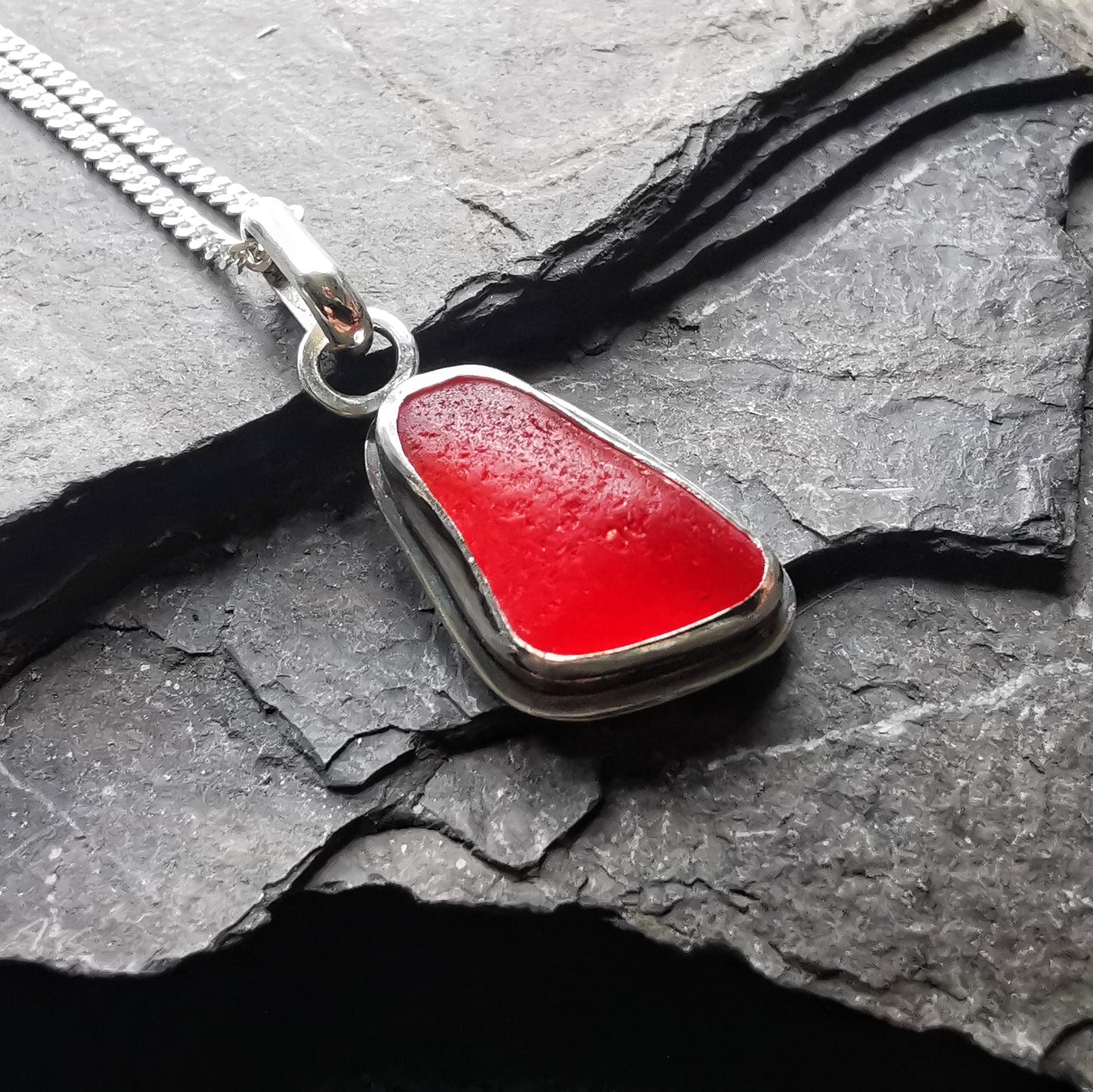 Scottish red sea glass & sterling silver pendant.