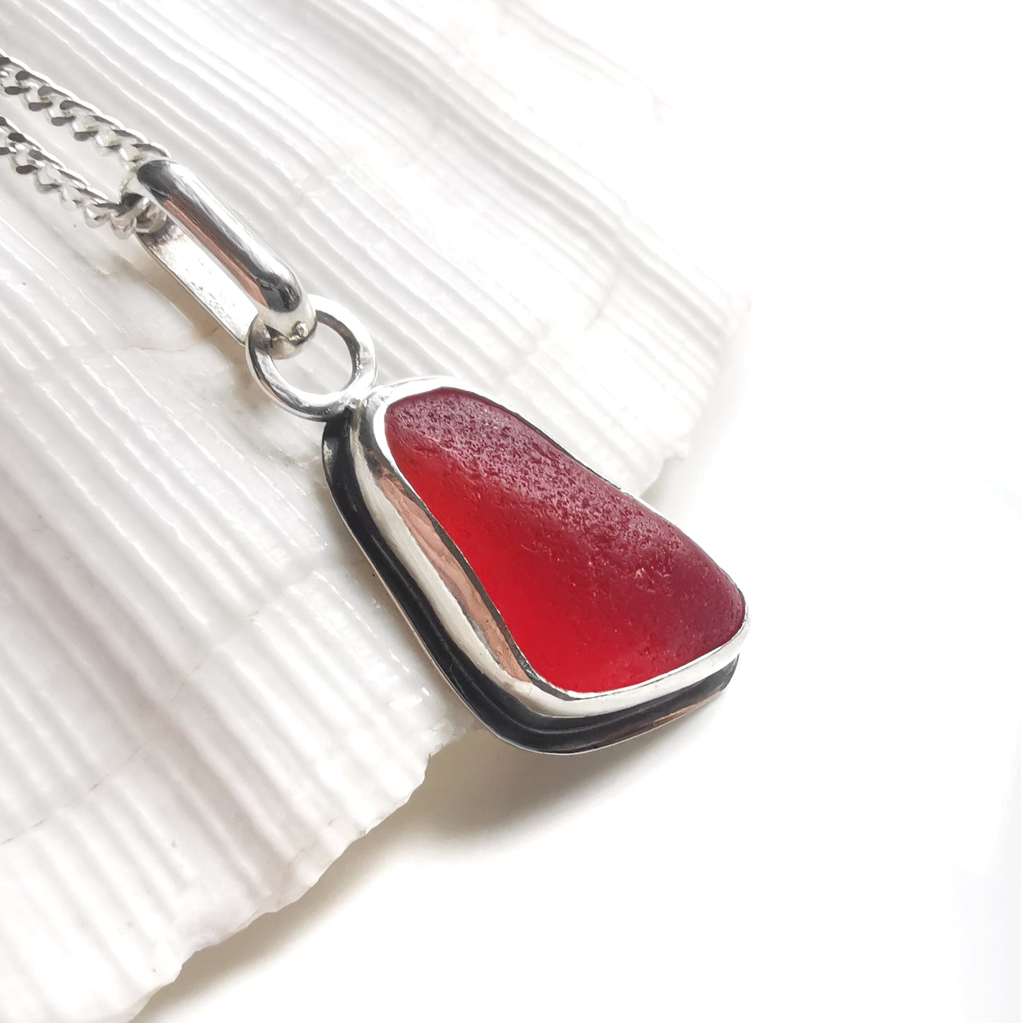 Scottish red sea glass & sterling silver pendant.