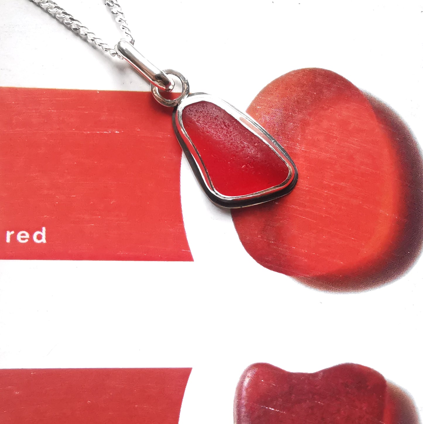Scottish red sea glass & sterling silver pendant.