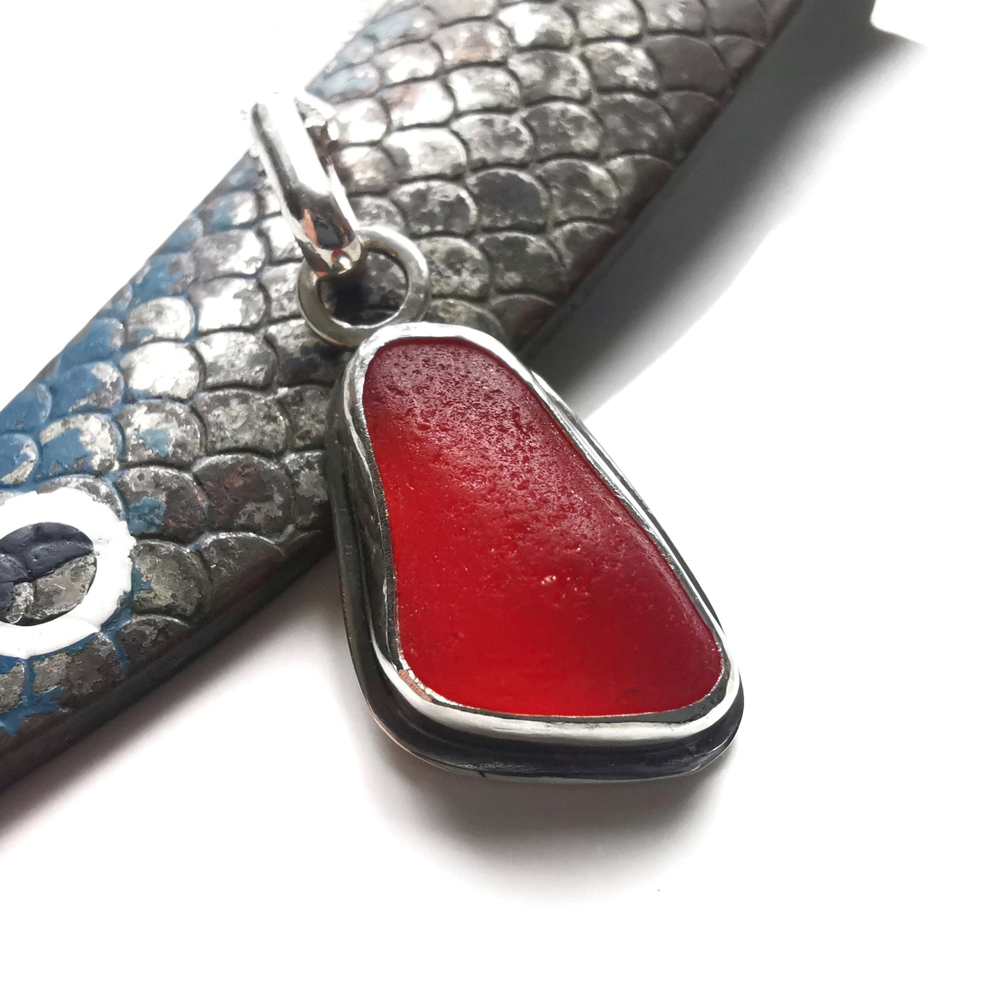 Scottish red sea glass & sterling silver pendant.