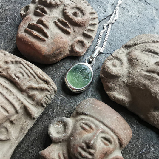 Green sea glass & sterling silver pendant.