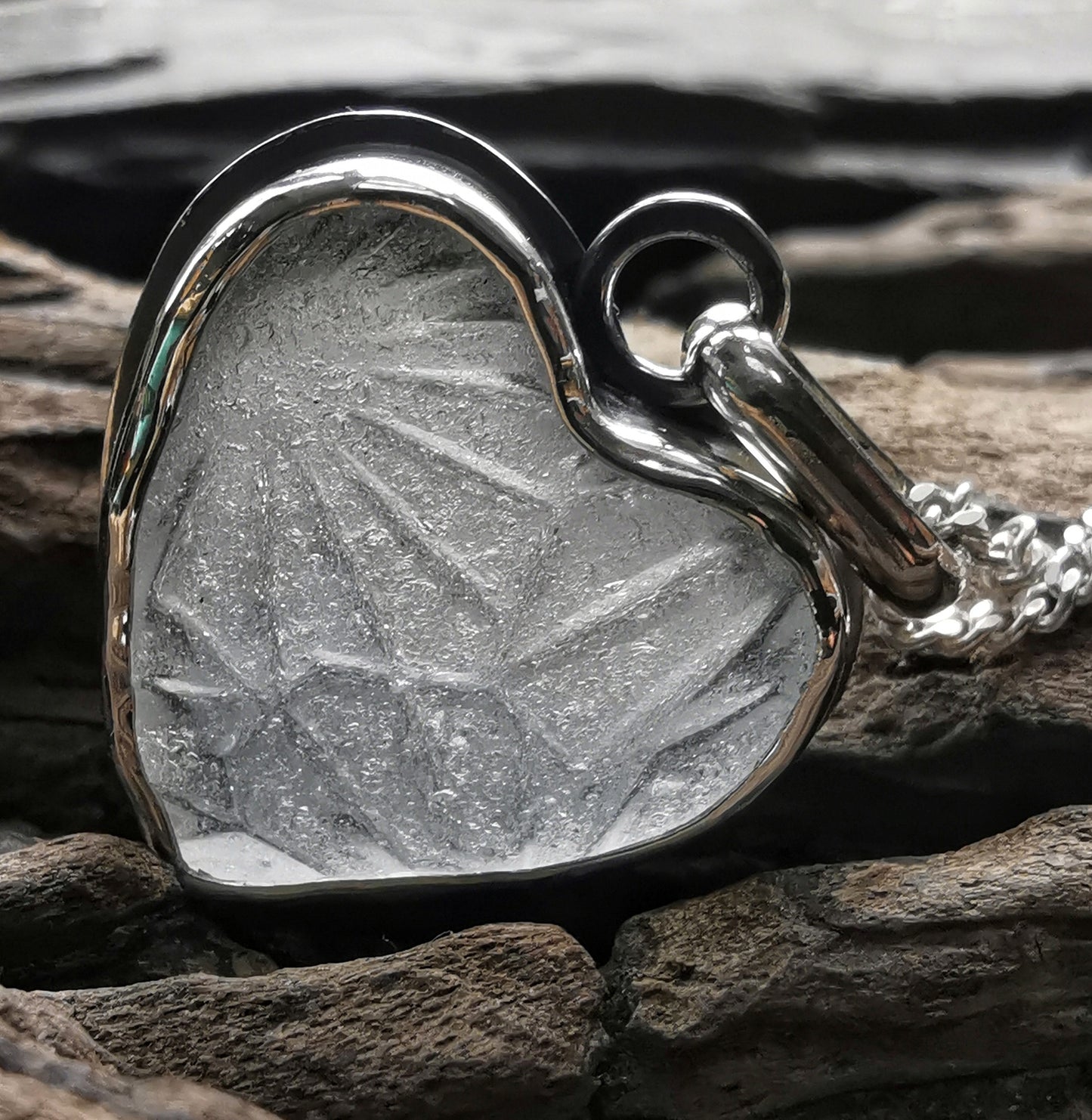 Clear sea glass heart & sterling silver pendant.