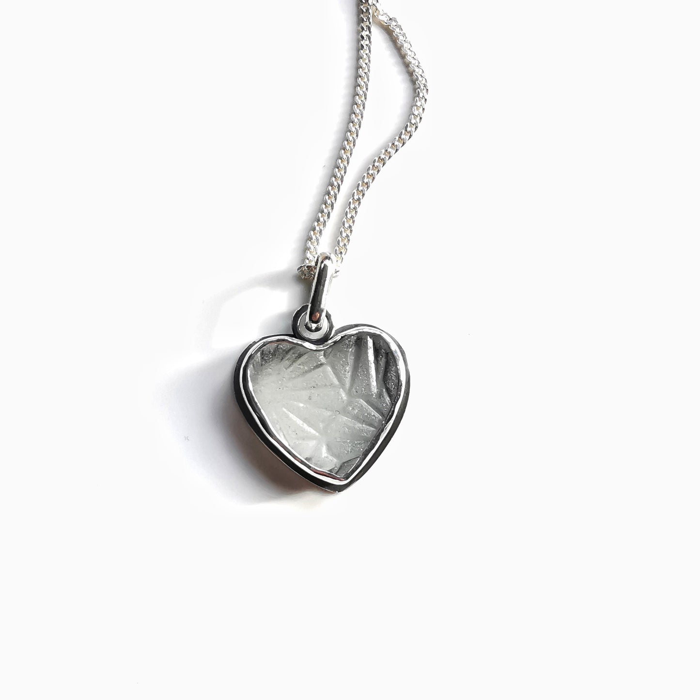 Clear sea glass heart & sterling silver pendant.
