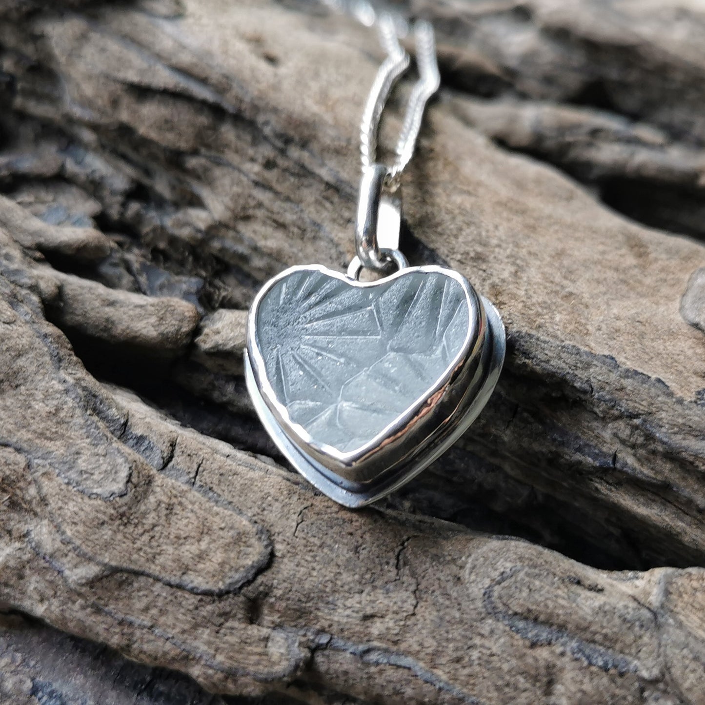 Clear sea glass heart & sterling silver pendant.