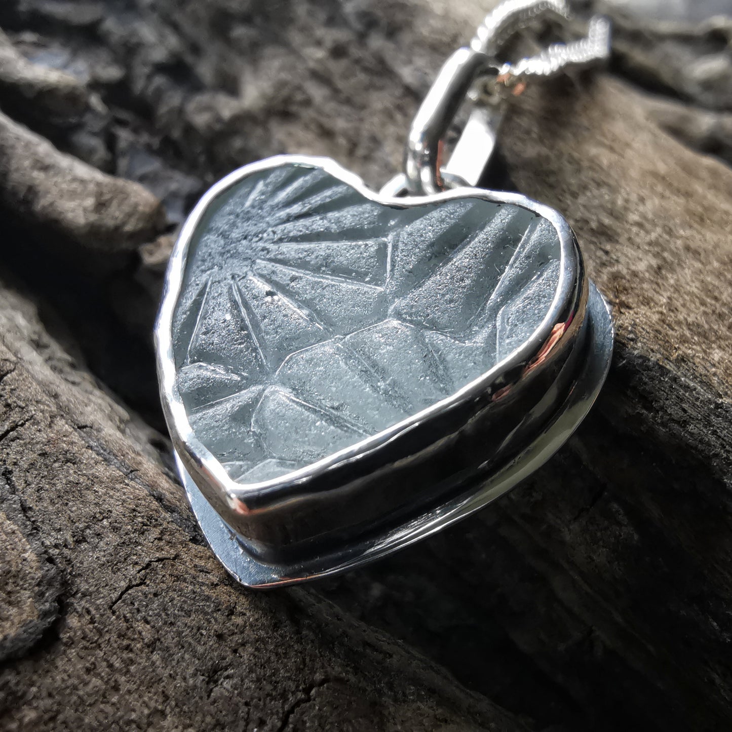 Clear sea glass heart & sterling silver pendant.