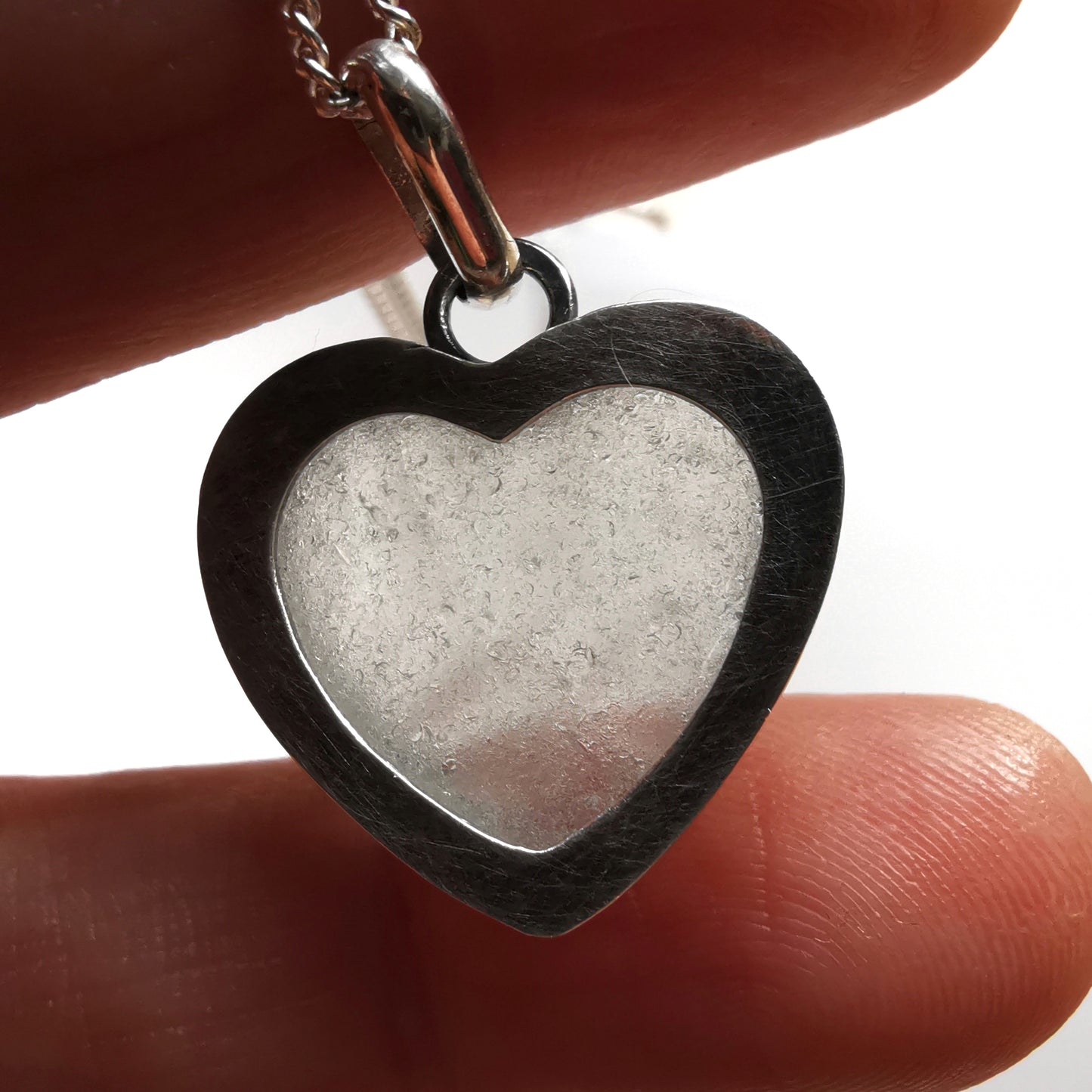 Clear sea glass heart & sterling silver pendant.