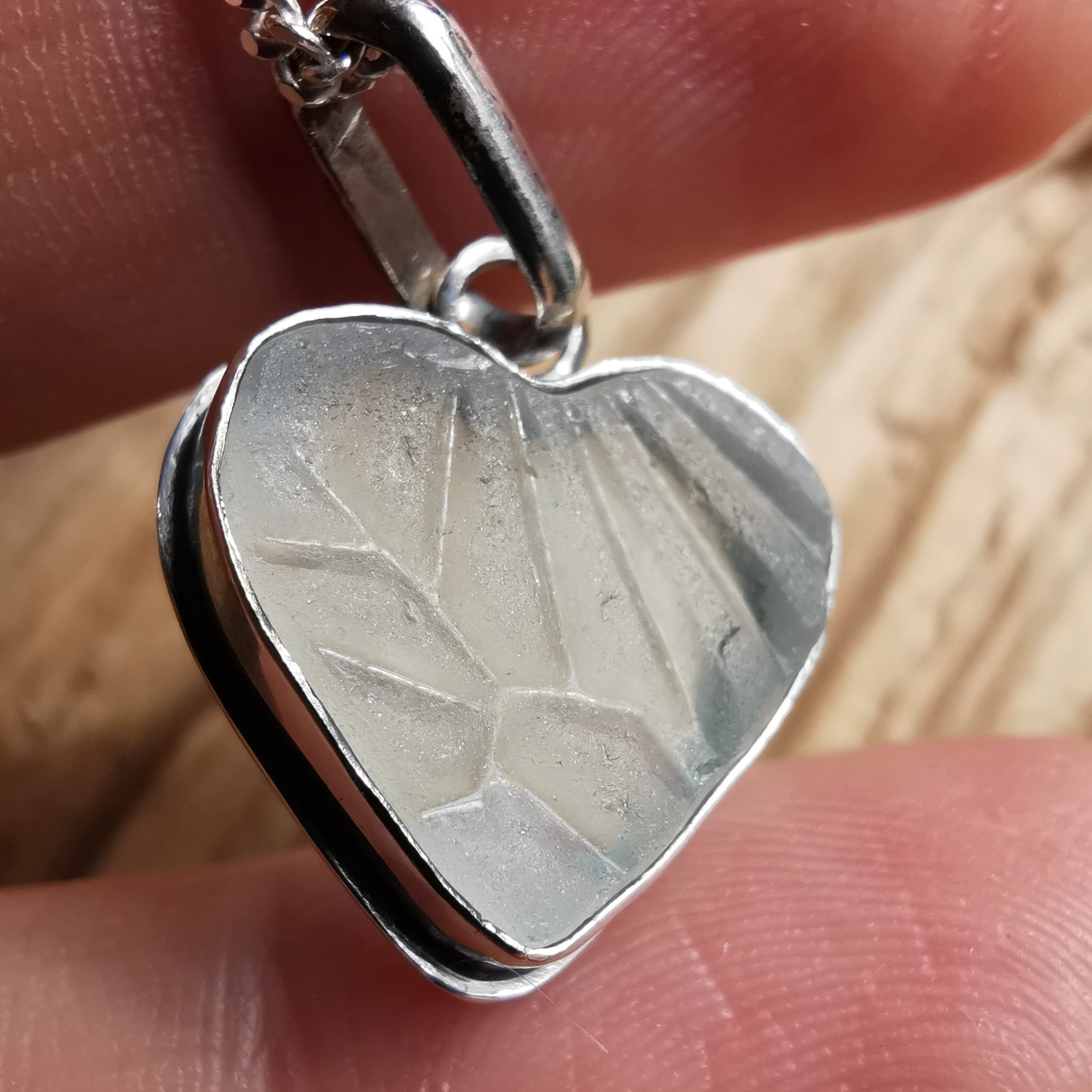 Clear sea glass heart & sterling silver pendant.