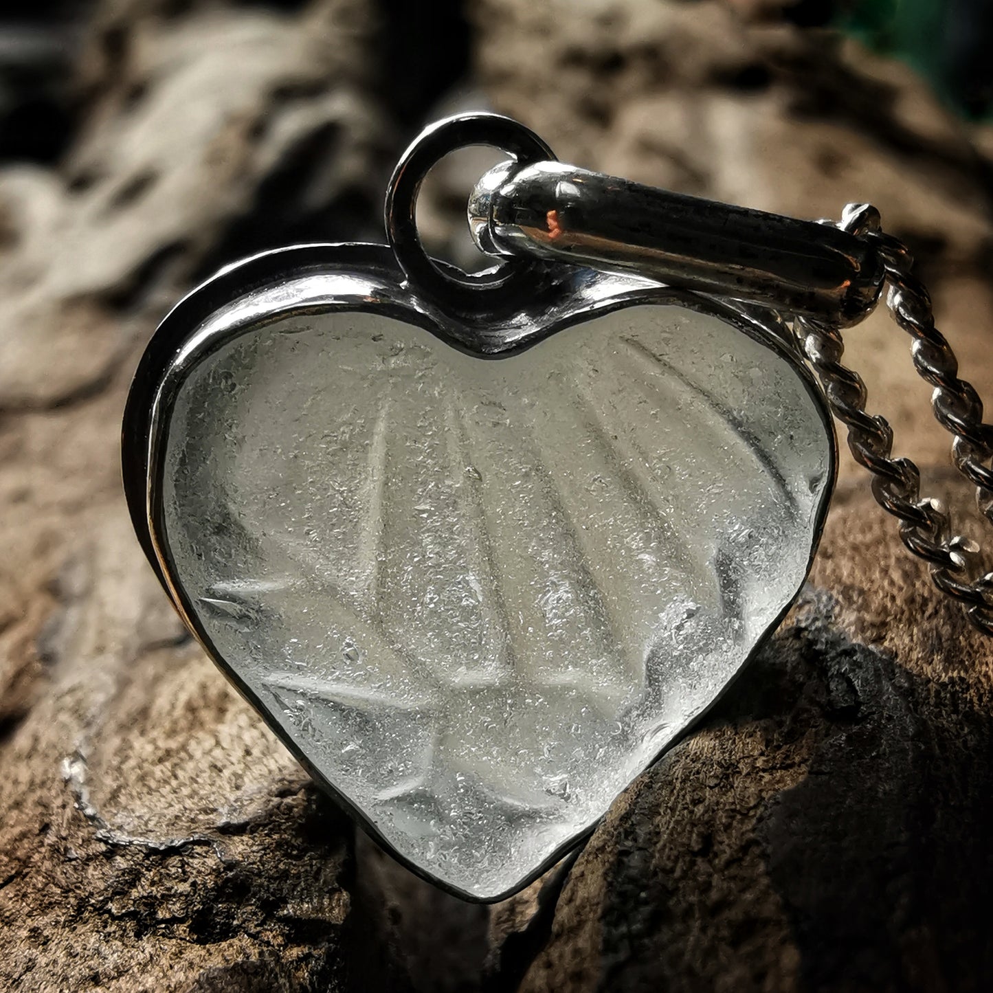 Clear sea glass heart & sterling silver pendant.