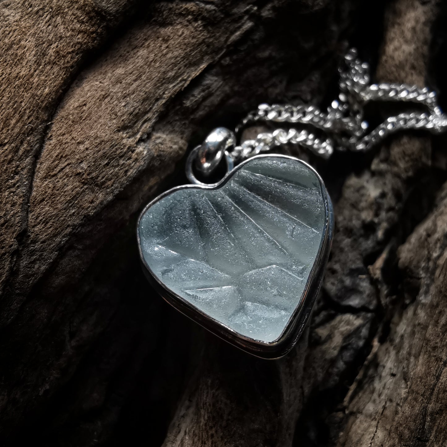 Clear sea glass heart & sterling silver pendant.