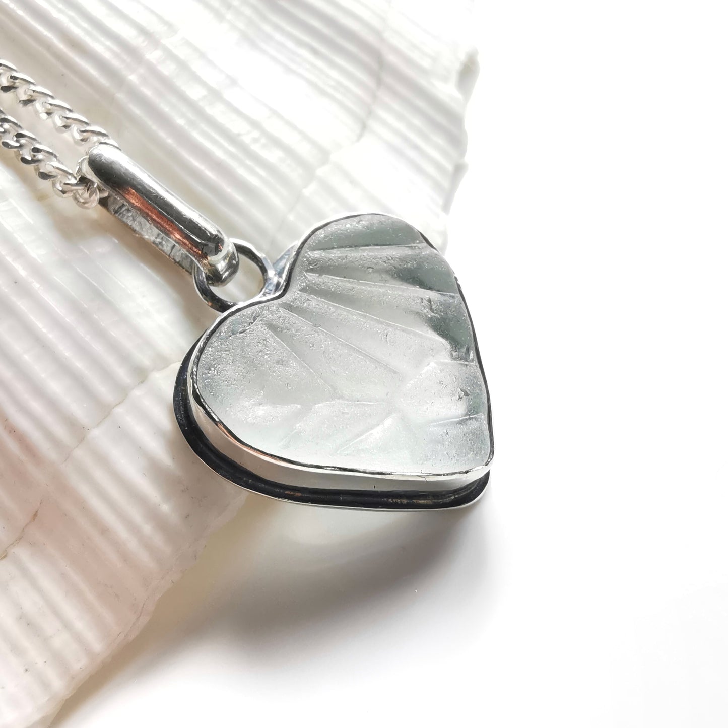 Clear sea glass heart & sterling silver pendant.