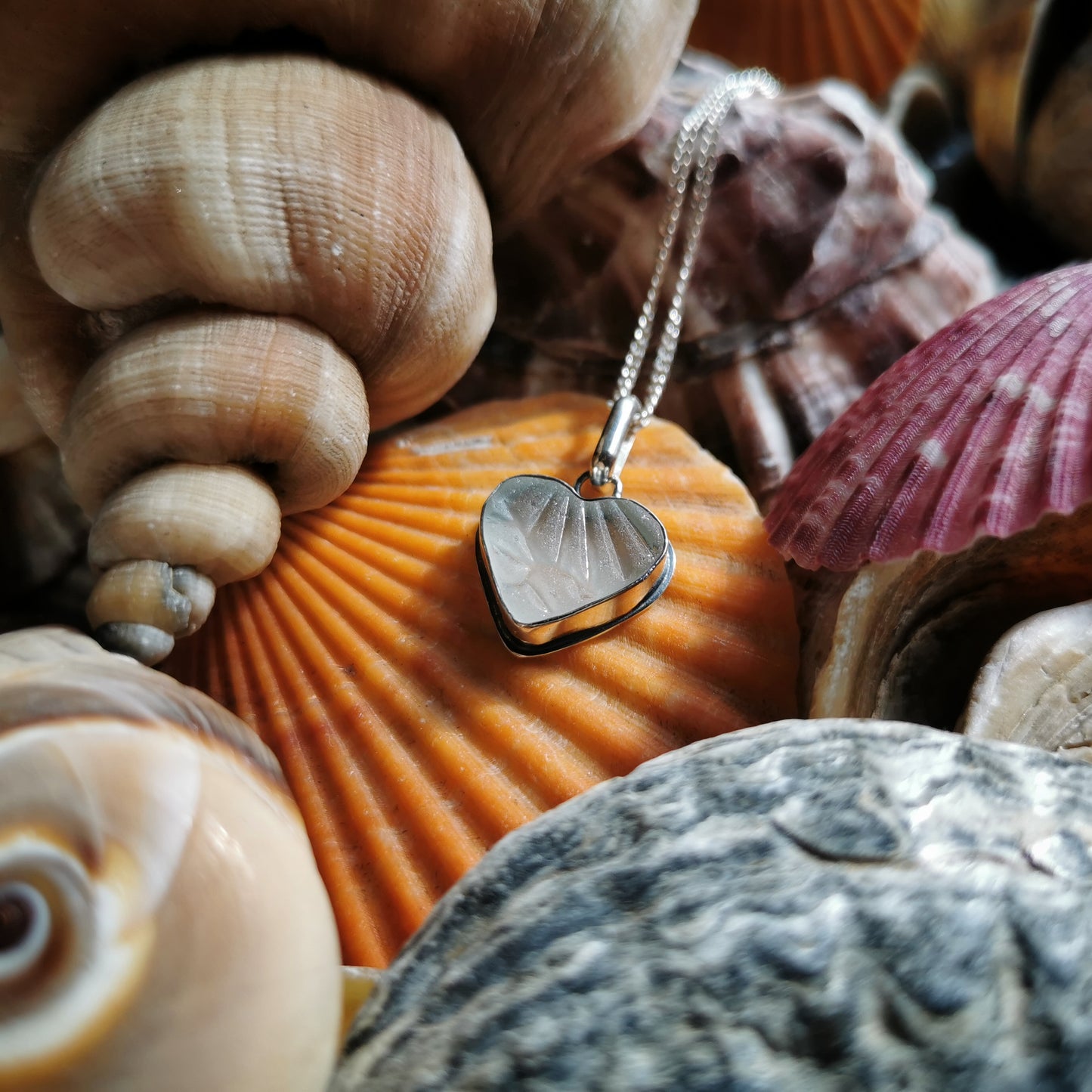 Clear sea glass heart & sterling silver pendant.