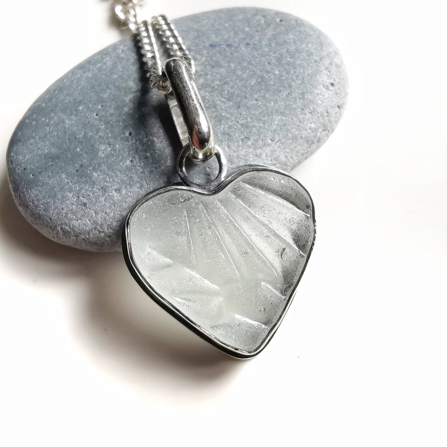 Clear sea glass heart & sterling silver pendant.