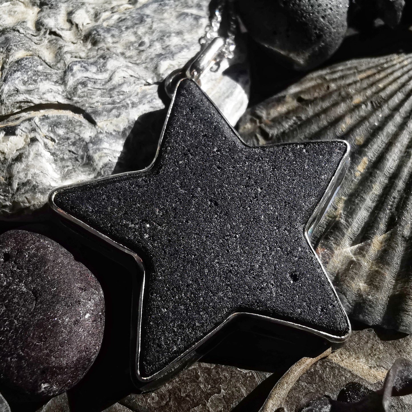 Scottish black sea glass star & sterling silver pendant.