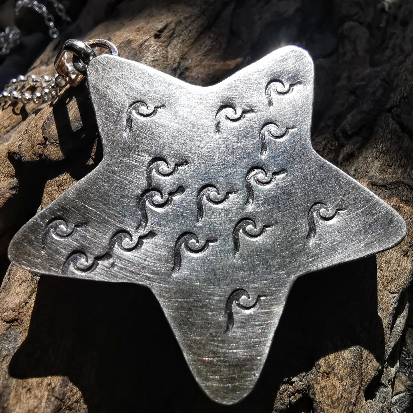 Scottish black sea glass star & sterling silver pendant.
