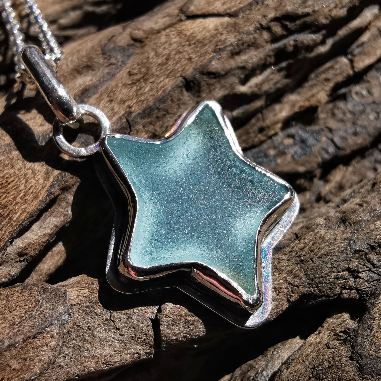 Reserved for Lesley. Scottish blue sea glass star & sterling silver pendant.