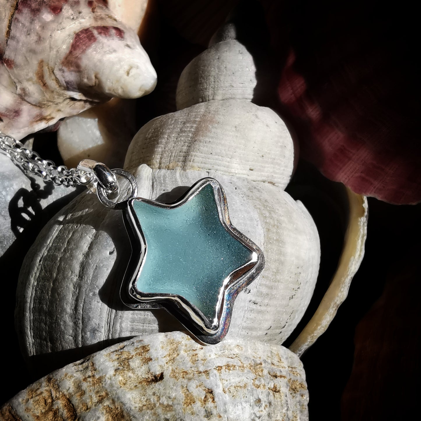 Reserved for Lesley. Scottish blue sea glass star & sterling silver pendant.