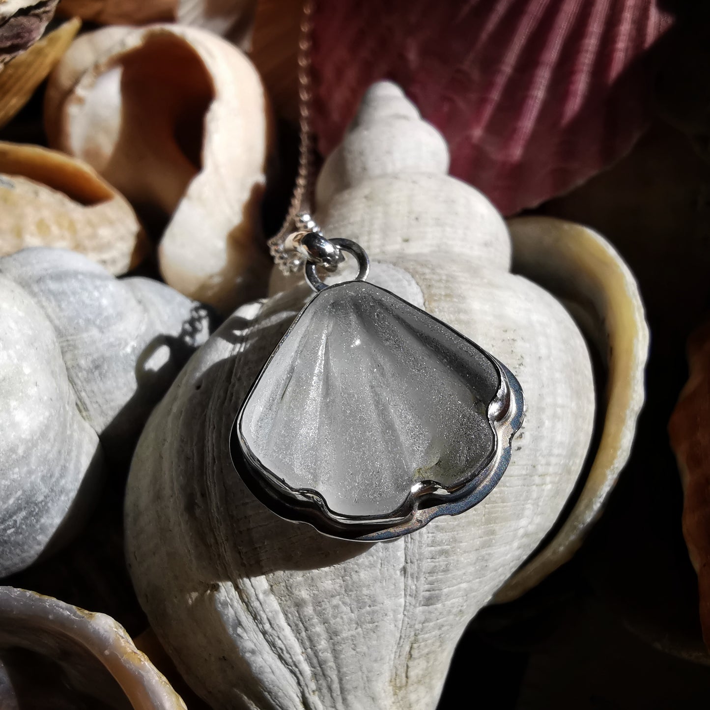 Reserved for Kerry. Scottish clear sea glass shell & sterling silver pendant.